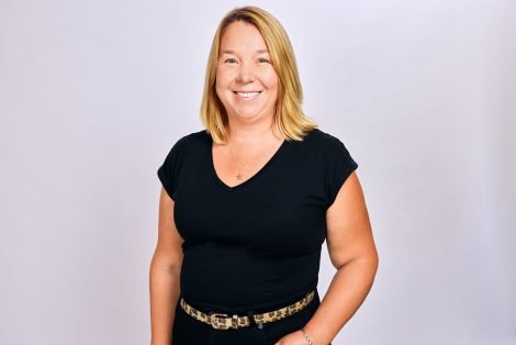 Claire Ellis of Land & New Homes Network smiling, wearing a black top